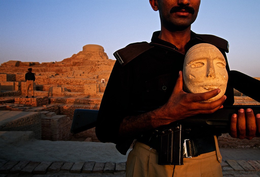 Guard at Mohenjo Daro Archaeology Site With Artifact in Sindh, Pakistan