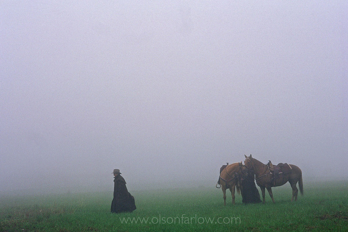 Equestrians on a Foggy Ride